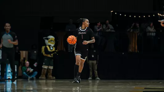 Leah Philpotts dribbles the ball up the court at William & Mary