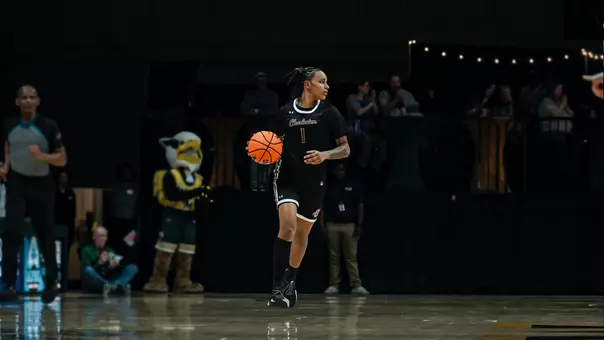 Leah Philpotts dribbles the ball up the court at William & Mary
