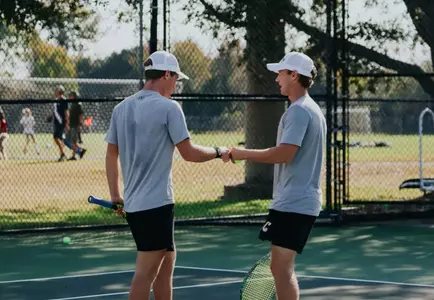 Jackson Kirby and Devin Ruhotina celebrate after winning a point