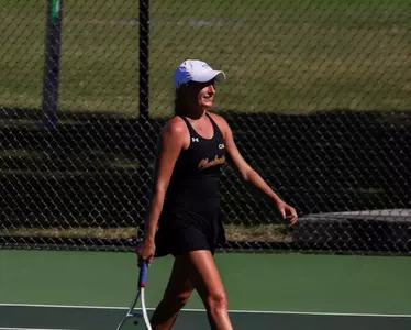 Riley Trinkle prepares to serve the next point