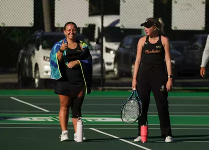 Marra Bruce and Olivia Bull cheer on teammates