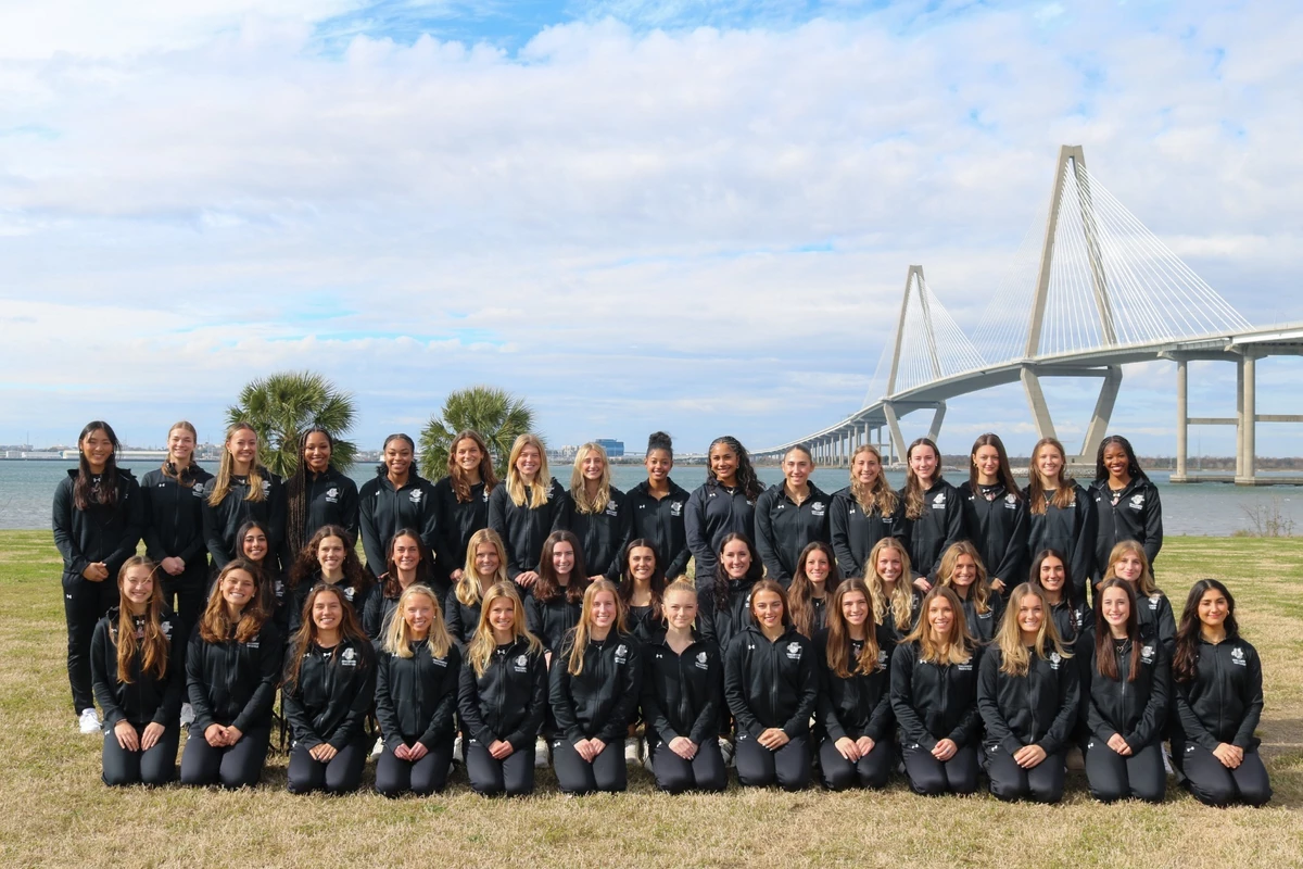 track and field team photo in front of Ravenel Bridge