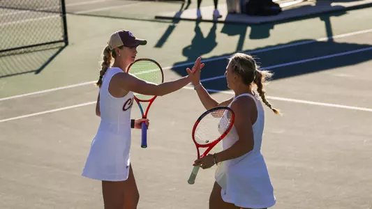 Saige Severance and Sia Cariov celebrate winning a point