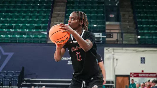 Taylor Barbot shoots three at UNCW