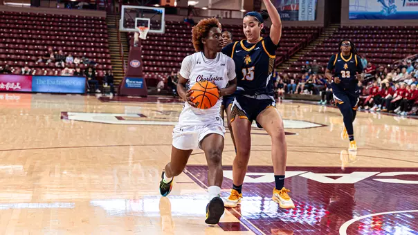 Taylor Barbot drives against NC A&T