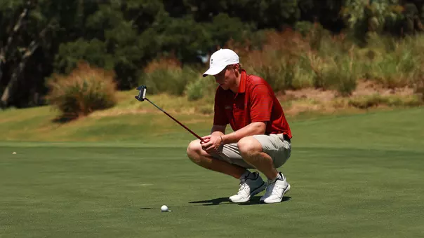 Jules Lauer looking at a putt on the green.