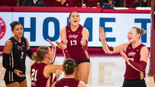 Madison Hewitson celebrating on the court with teammates.