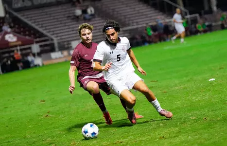 Federico Bellisi battles a defender