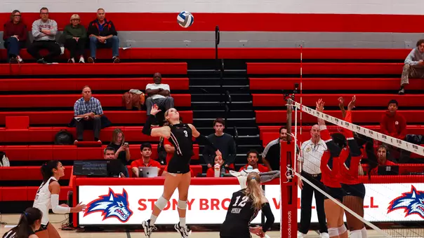 Julia Gnida jumping to hit a volleyball at Stony Brook Oct. 16.