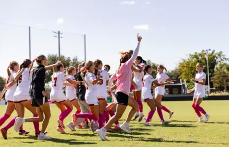 Women's Soccer running onto field