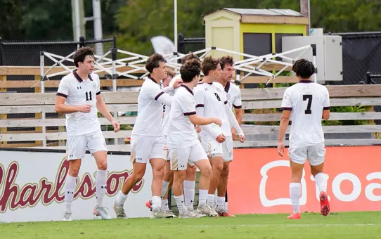 men's soccer celebratory huddle