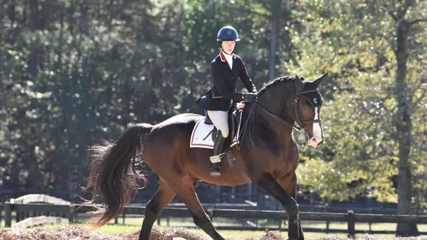 Kenda Murray riding a horse during competition.