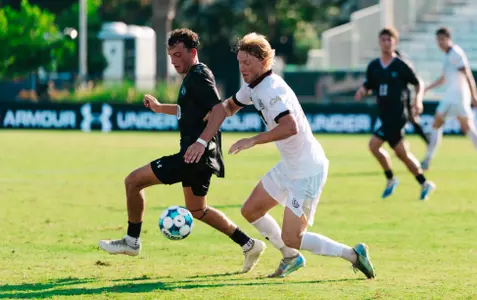 Paul Kileen battles a defender