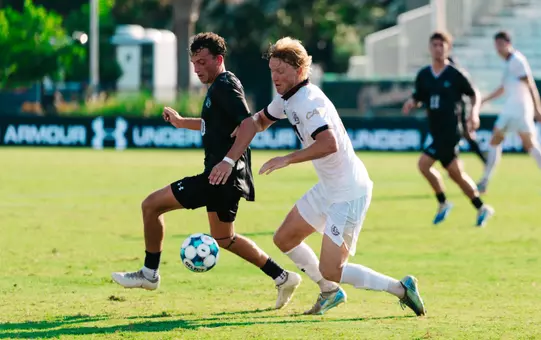 Paul Kileen battles a defender