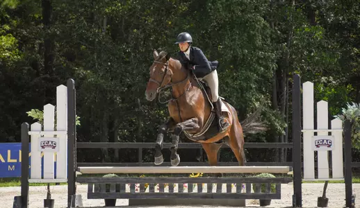 Meredith Miramonti jumps on her horse