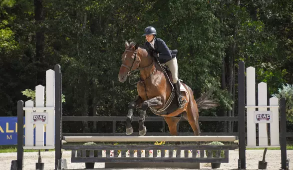 Meredith Miramonti jumps on her horse