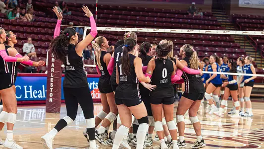 Charleston volleyball celebrating the win against Hampton Oct. 9.