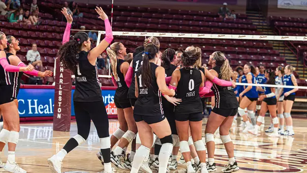 Charleston volleyball celebrating the win against Hampton Oct. 9.