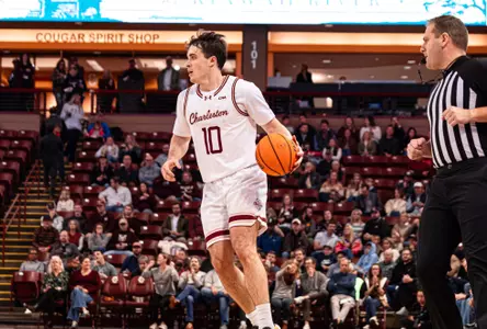 Connor Hickman dribbles the basketball