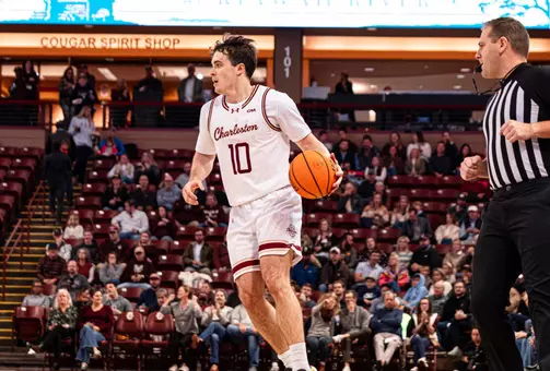 Connor Hickman dribbles the basketball