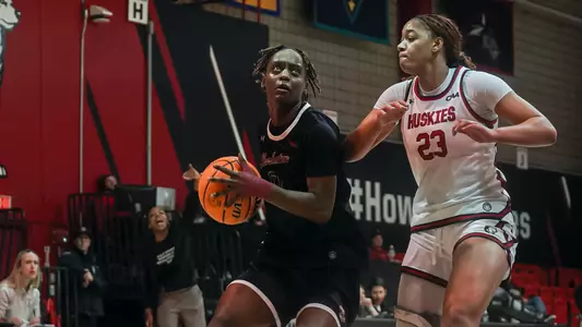 Taylor Barbot goes by defender at Northeastern