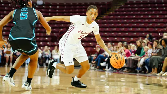 Taryn Barbot dribbles by defender