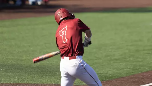 Jackson Berini swinging at a pitch.