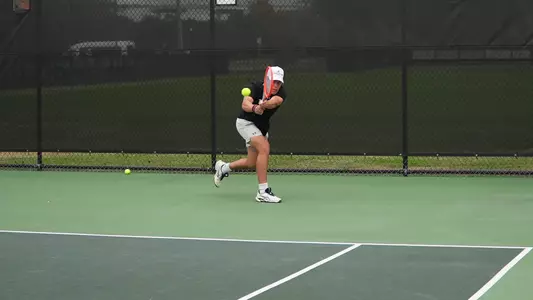 Jordy Larke returns ball