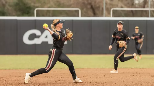 Julia Sitterding throwing a ball from third base