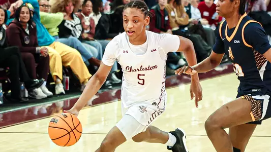 Taryn Barbot dribbles by defender