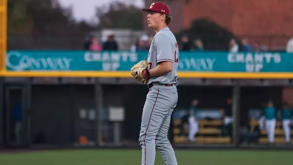 Ryan Hench waiting to throw a pitch at Coastal Carolina.