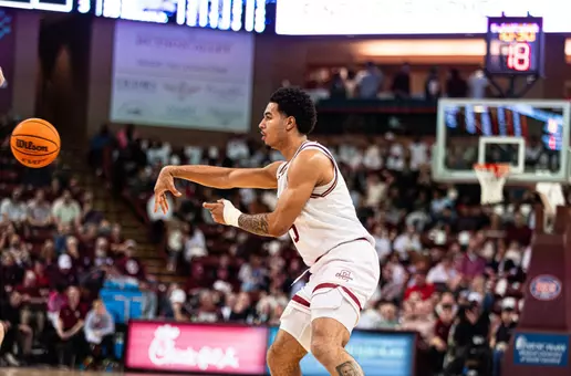Martin Kalu passes the basketball