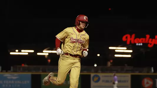 Jake Amman running the bases after hitting a grand slam.