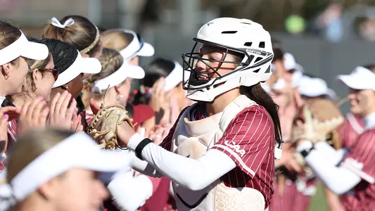 Leela Langston high fiving teammates
