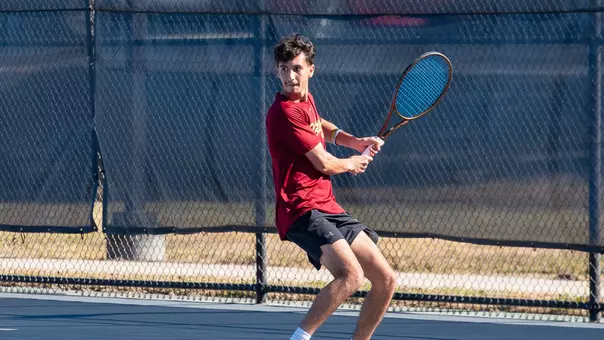 Dani Farran prepares to hit tennis ball