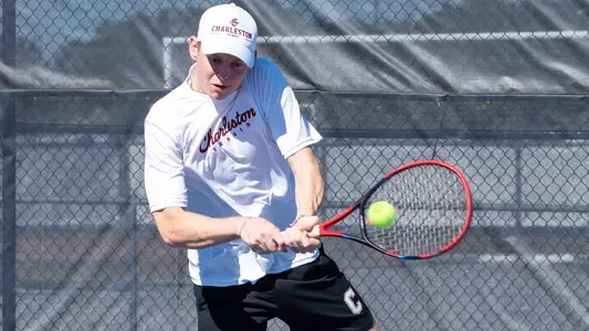 Jakub Solarski returns tennis ball