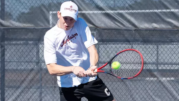 Jakub Solarski returns tennis ball