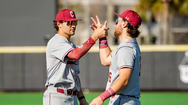 Jake Amman and Landon Penfield doing a handshake pregame.