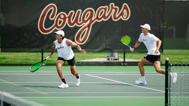 Juan Diego Rojas Mora and Leon Harder rally during a point