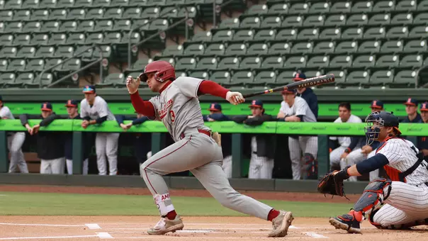 Jake Amman hitting a single Feb. 28 against Illinois.