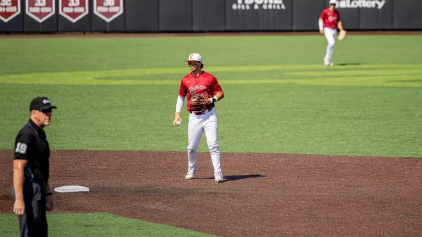 Ethan Plyler holding a baseball in the infield March 21, 2026 against UNCW.