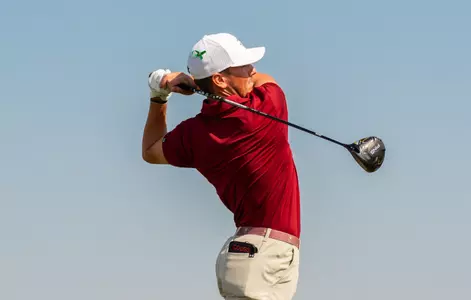 Miles Eubanks swings the golf club