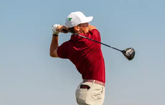 Miles Eubanks swings the golf club