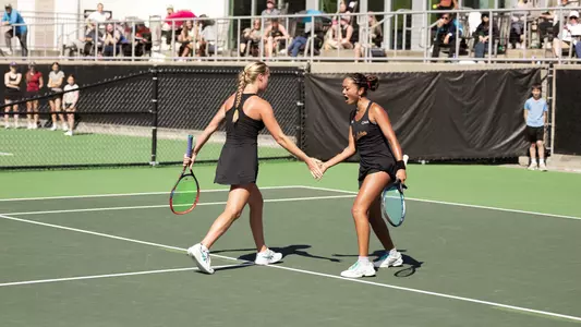 Oziera Ahmad and Riley Trinkle celebrate winning a point