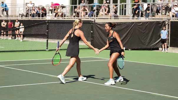 Oziera Ahmad and Riley Trinkle celebrate winning a point
