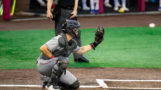 Dylan Johnson catching a baseball.