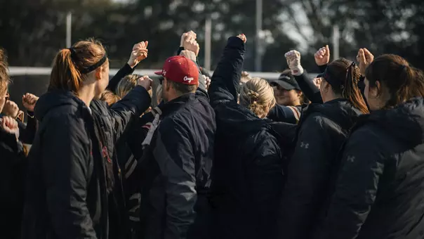 Charleston softball in a huddle post-game
