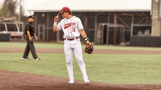 Ethan Plyler looking into the outfield while playing 3B.