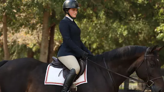 Lily Kress riding a horse.
