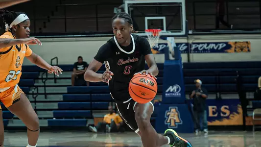 Taylor Barbot dribbles ball up the court